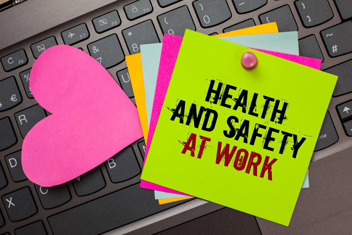 Text sign showing Health And Safety At Work. Conceptual photo Secure procedures prevent accidents avoid danger Bright colorful written papers pinch by pin pink heart on computer keyboard.